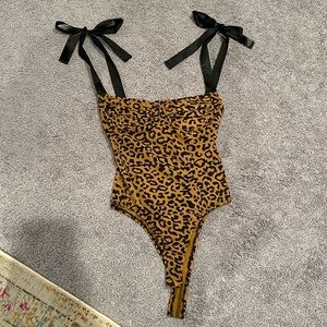 Cheetah print body suit with bow straps